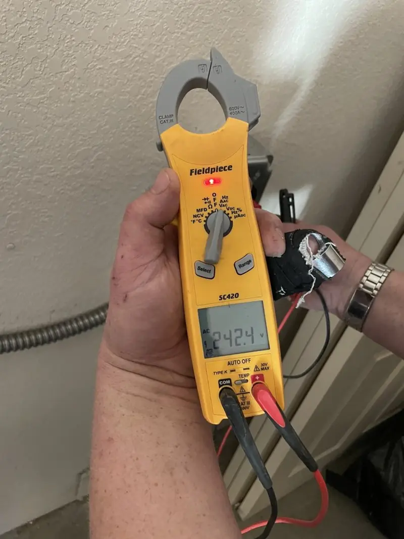 Voltage testing with clamp meter during Electrical Installation Services in Heber-Overgaard